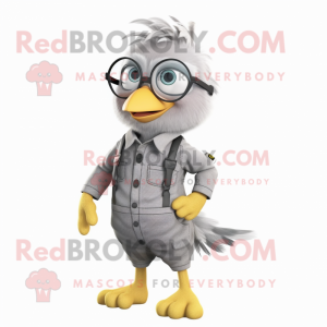 Gray Canary mascot costume character dressed with a Overalls and Eyeglasses