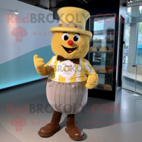 Gold Cupcake mascot costume character dressed with a Button-Up Shirt and Hat pins