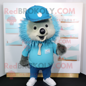 Cyan Porcupine mascot costume character dressed with a Oxford Shirt and Hat pins