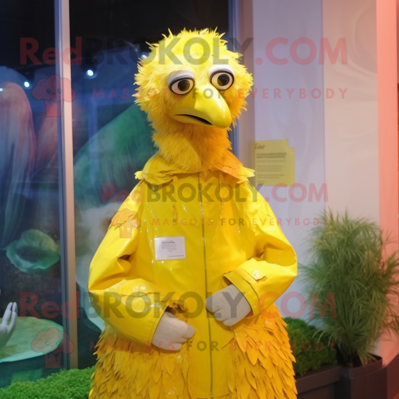 Lemon Yellow Ostrich mascot costume character dressed with a Raincoat and Cummerbunds