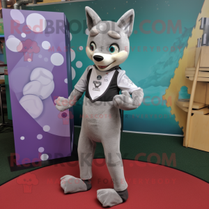 Silver Dingo mascot costume character dressed with a Yoga Pants and Bow ties