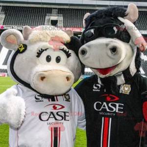 2 mascotte mucca, una bianca e una nera - Redbrokoly.com