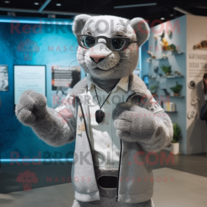Silver Jaguarundi mascot costume character dressed with a Coat and Eyeglasses