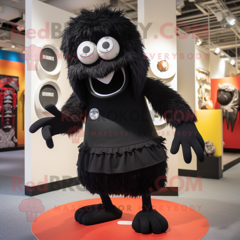 Black Cyclops mascot costume character dressed with a Poplin Shirt and Shoe laces