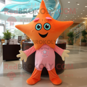 Peach Starfish mascot costume character dressed with a T-Shirt and Scarves