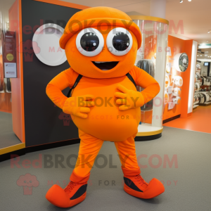 Orange Cyclops mascot costume character dressed with a Jeggings and Belts