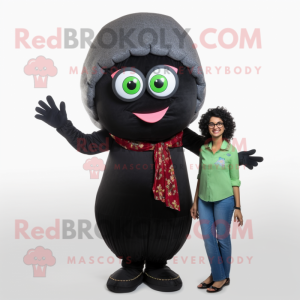 Black Falafel mascot costume character dressed with a Mom Jeans and Reading glasses