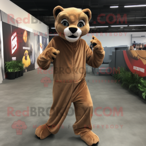 Brown Mountain Lion mascot costume character dressed with a Jumpsuit and Headbands