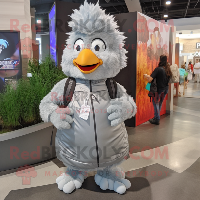 Silver Chicken Parmesan mascot costume character dressed with a Jacket and Backpacks