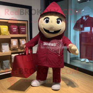 Maroon Candy Box mascot costume character dressed with a Windbreaker and Tote bags