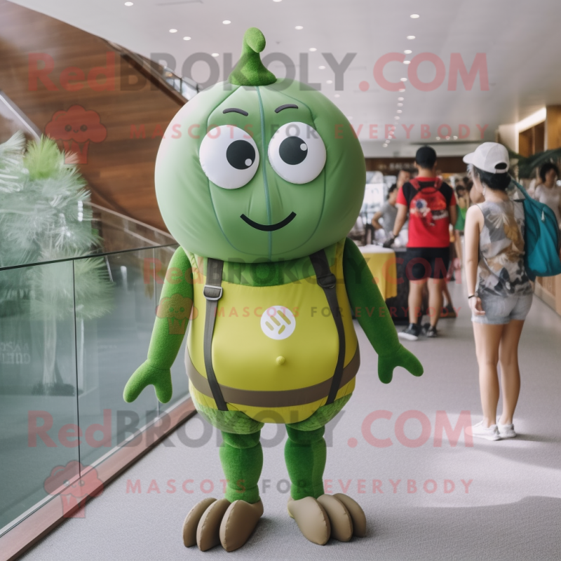 Olive Candy Box mascot costume character dressed with a One-Piece Swimsuit and Backpacks