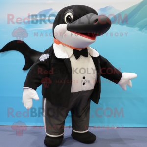 Black Killer Whale mascot costume character dressed with a Bermuda Shorts and Bow ties