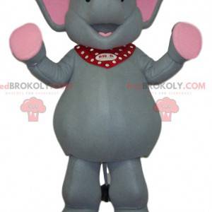 Mascote elefante cinza e rosa muito feliz - Redbrokoly.com