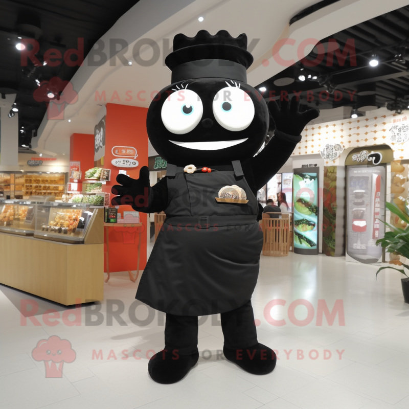 Black Sushi mascot costume character dressed with a Overalls and Brooches