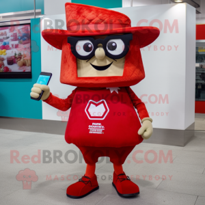 Red Nachos mascot costume character dressed with a Bermuda Shorts and Reading glasses