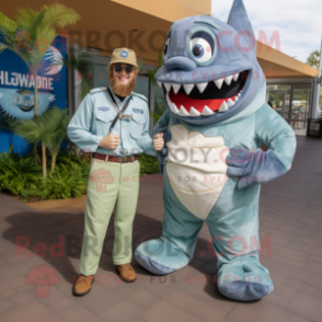 Olive Megalodon mascot costume character dressed with a Chambray Shirt and Watches