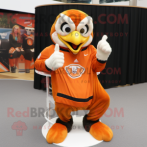 Orange Eagle mascot costume character dressed with a Sweater and Rings