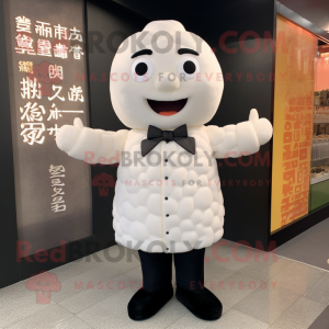 White Dim Sum mascot costume character dressed with a Suit Jacket and Foot pads