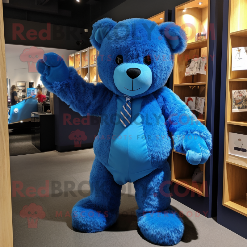 Blue Teddy Bear mascot costume character dressed with a Vest and Clutch bags Mascot Costumes Redbrokoly