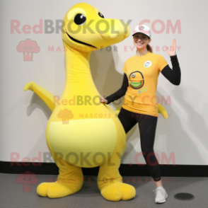 Yellow Brachiosaurus mascot costume character dressed with a Yoga Pants and Caps