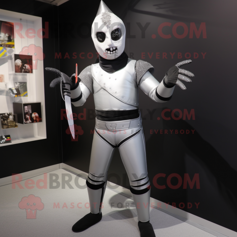 Silver Knife Thrower mascot costume character dressed with a Rash Guard and Cummerbunds