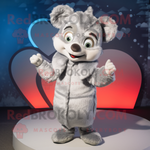 Silver Heart mascot costume character dressed with a Coat and Mittens