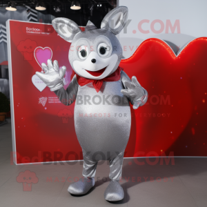 Silver Heart mascot costume character dressed with a Coat and Mittens