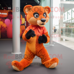 Orange Jaguarundi mascot costume character dressed with a Culottes and Foot pads