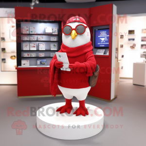 Red Dove mascot costume character dressed with a Cardigan and Reading glasses