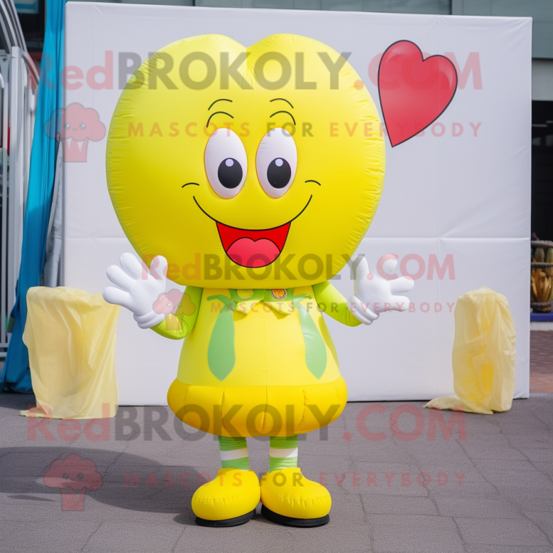 Lemon Yellow Heart Shaped Balloons mascot costume character dressed with a Cardigan and Beanies