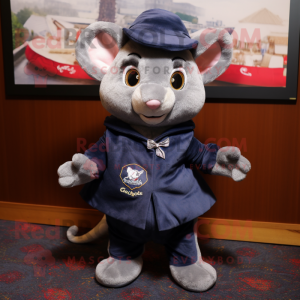 Navy Dormouse mascot costume character dressed with a T-Shirt and Shawl pins