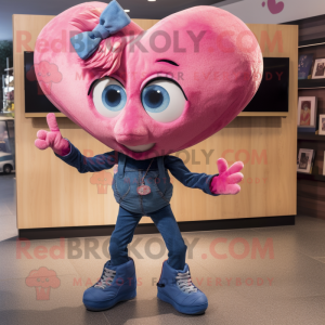 Pink Heart mascot costume character dressed with a Jeans and Earrings