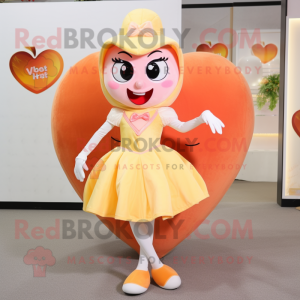 Peach Heart mascot costume character dressed with a Shift Dress and Foot pads