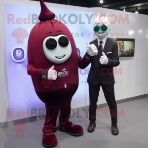 Maroon Onion mascot costume character dressed with a Suit Jacket and Smartwatches