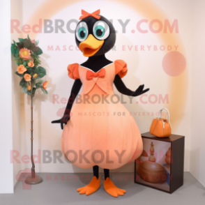 Peach Blackbird mascot costume character dressed with a Shift Dress and Rings