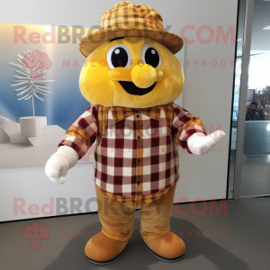 Gold Cherry mascot costume character dressed with a Flannel Shirt and Hat pins