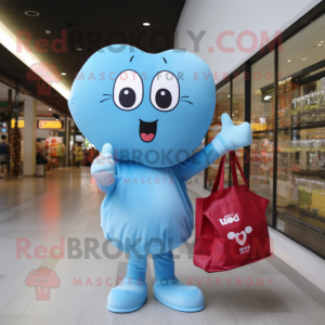 Sky Blue Heart mascot costume character dressed with a T-Shirt and Tote bags