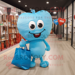 Sky Blue Heart mascot costume character dressed with a T-Shirt and Tote bags