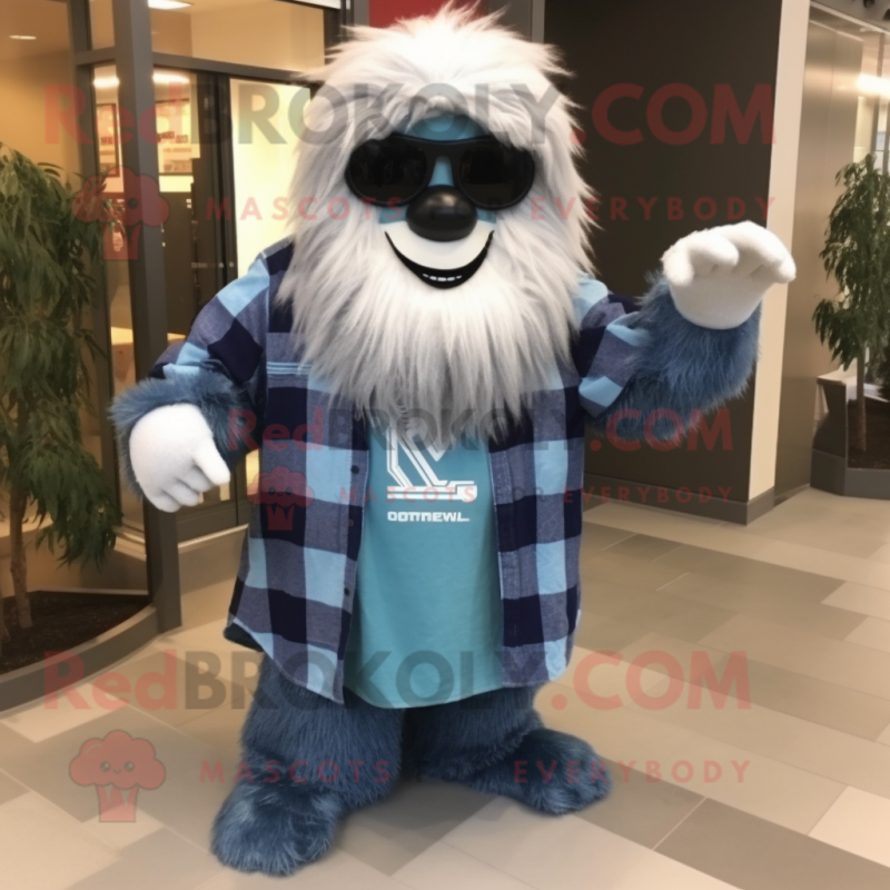 Navy Yeti mascot costume character dressed with a Flannel Shirt and Sunglasses