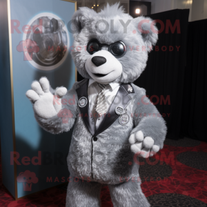 Silver Teddy Bear mascot costume character dressed with a Suit Jacket and Rings