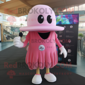 Pink Jellyfish mascot costume character dressed with a Polo Shirt and Hat pins