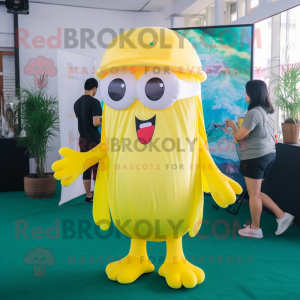 Yellow Jellyfish mascot costume character dressed with a Jumpsuit and Reading glasses