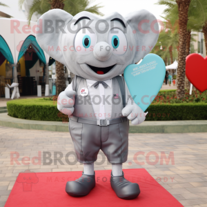 Silver Heart mascot costume character dressed with a Shorts and Pocket squares