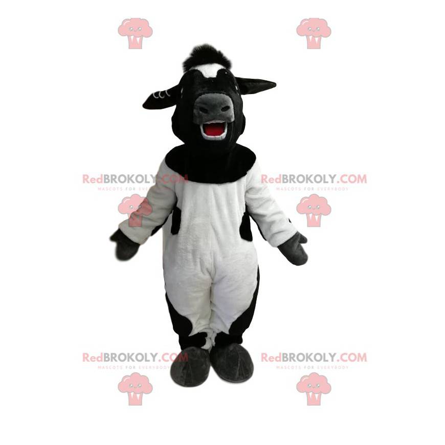 Mascotte della mucca in bianco e nero molto felice -