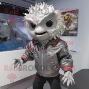 Silver Tuna mascot costume character dressed with a Moto Jacket and Hair clips