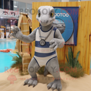 Silver Komodo Dragon mascot costume character dressed with a Board Shorts and Bracelet watches