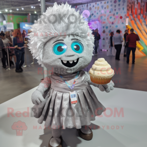 Silver Cupcake mascot costume character dressed with a Button-Up Shirt and Shawl pins