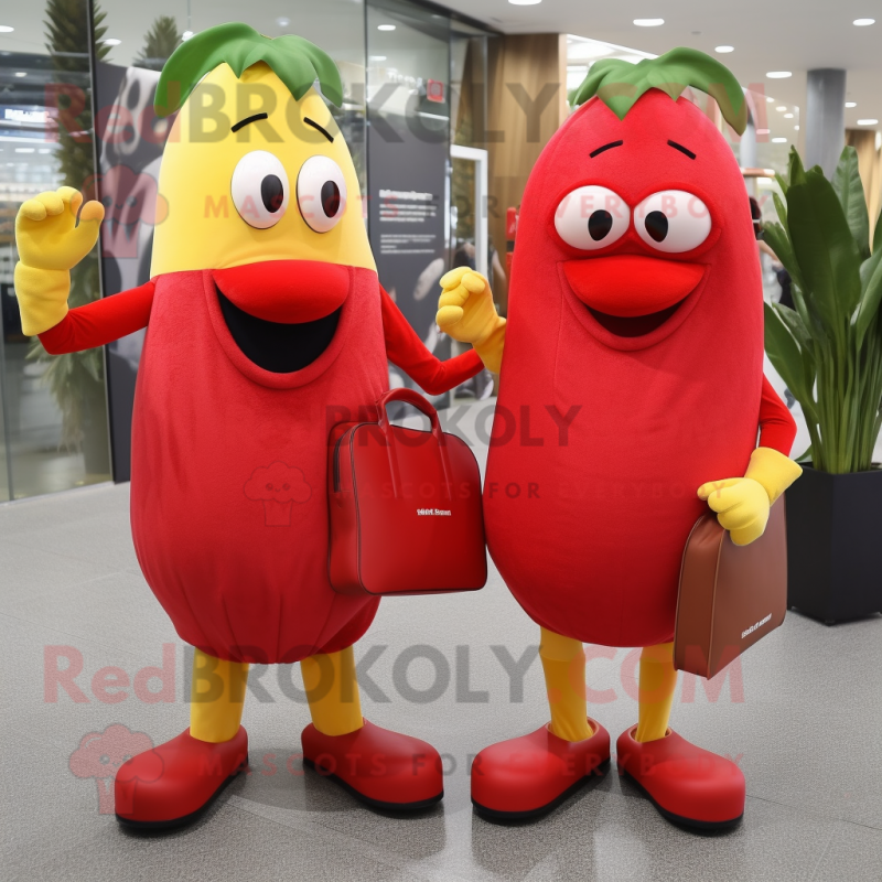 Red Banana mascot costume character dressed with a Midi Dress and Briefcases