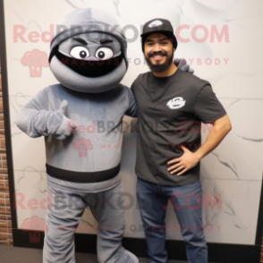 Gray Ninja mascot costume character dressed with a Henley Tee and Berets