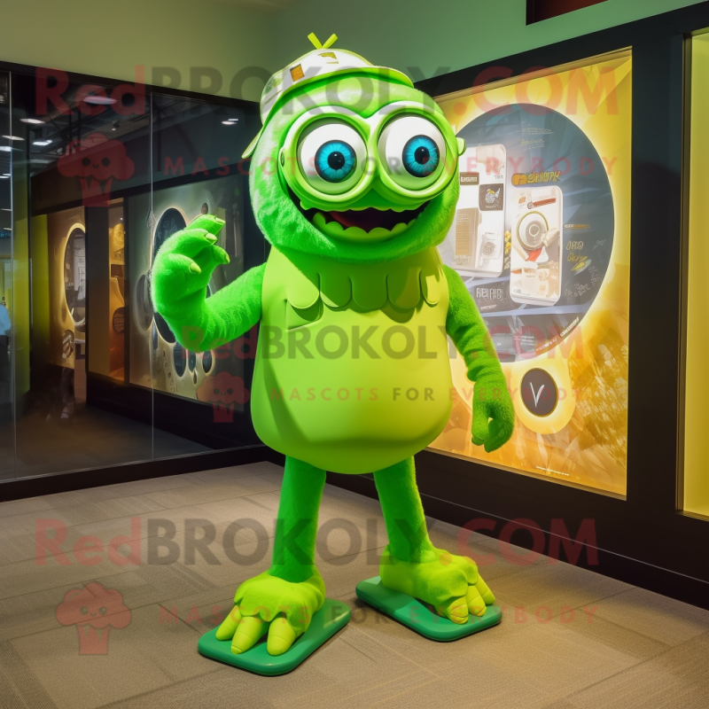 Lime Green Cyclops mascot costume character dressed with a Graphic Tee and Eyeglasses